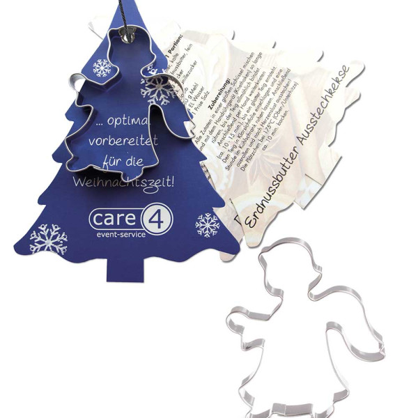 Baking shape with recipe book fir tree